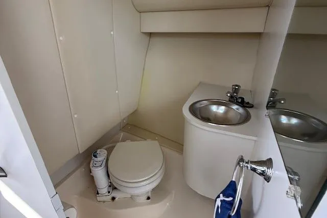 Slide: The Image of 2003 Tiara Yachts 2900 Coronet bathroom with toilet and sink. - 27