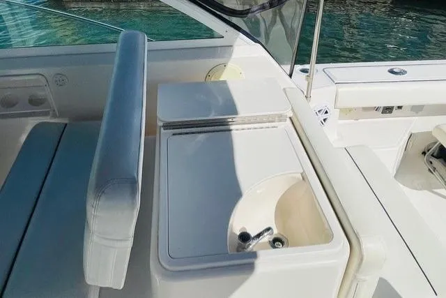 Slide: The Image of 2003 Tiara Yachts 2900 Coronet bathroom with toilet, sink, and mirror. - 36