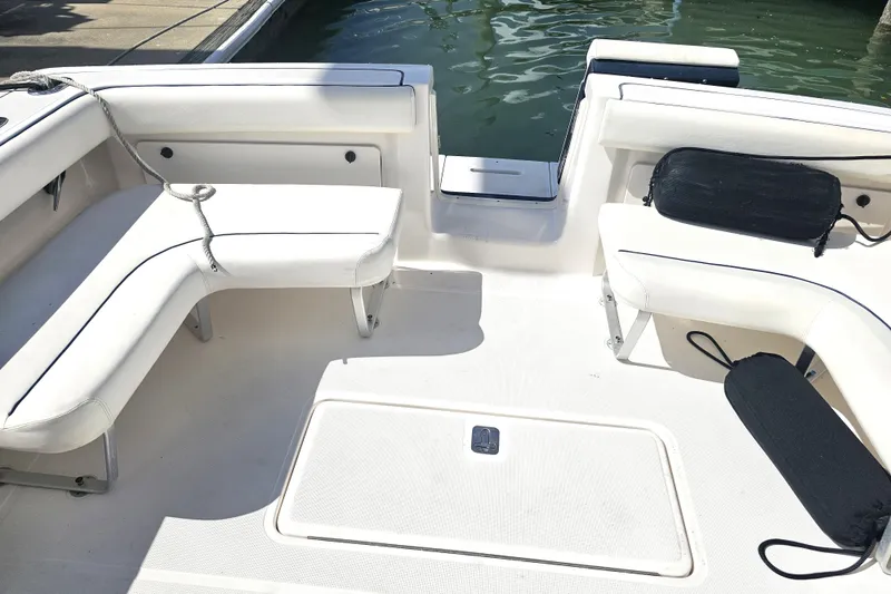 Slide: The Image of 2003 Tiara Yachts 2900 Coronet boat interior with white seating and water view. - 37