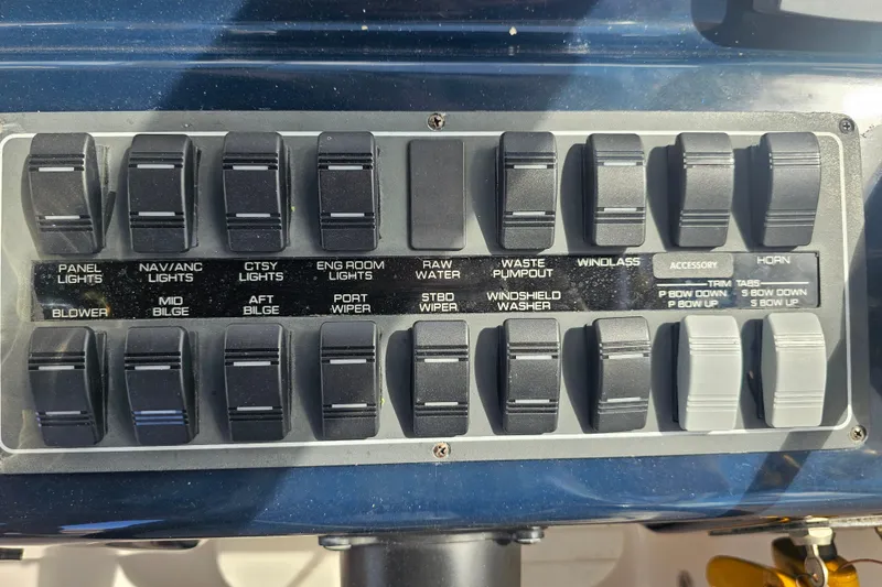 Slide: The Image of Control panel of a 2003 Tiara Yachts 2900 Coronet with labeled switches. - 40