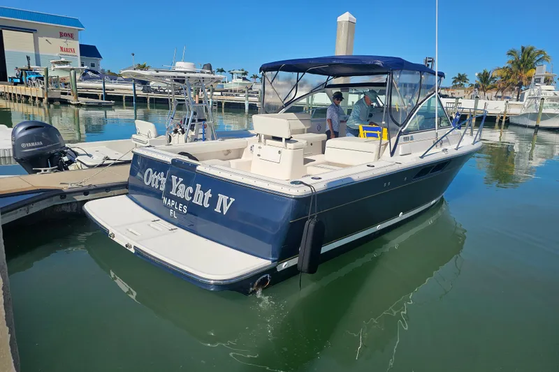 Slide: The Image of 2003 Tiara Yachts 2900 Coronet, "Ott's Yacht IV," docked in Naples, FL marina. - 9