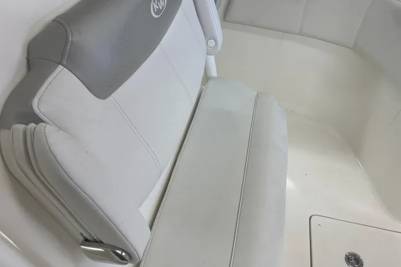 Slide: The Image of 2023 Key West 263 FS boat interior with white and gray seating. - 20