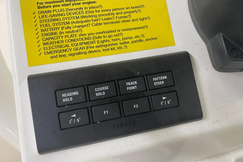 Slide: The Image of Control panel of a 2023 Key West 263 FS boat with safety checklist. - 30