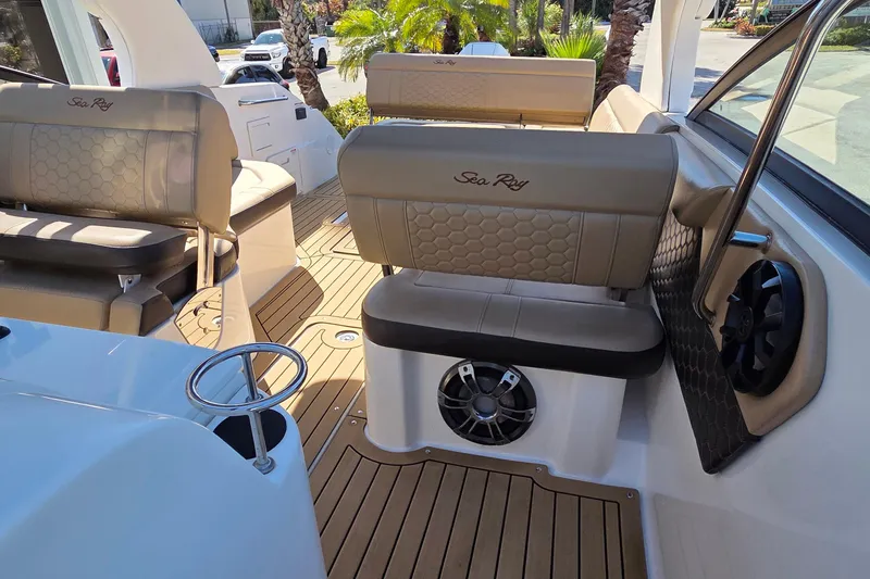 Slide: The Image of 2020 Sea Ray SDX 250 Outboard interior with tan seating and teak flooring. - 22