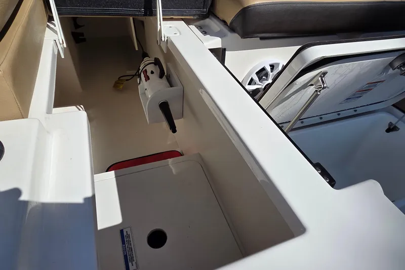 Slide: The Image of 2020 Sea Ray SDX 250 Outboard interior storage and seating area. - 29