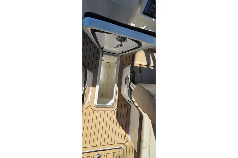 Slide: The Image of 2020 Sea Ray SDX 250 Outboard interior storage compartment with teak flooring. - 31