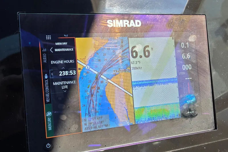 Slide: The Image of Simrad display on 2020 Sea Ray SDX 250 Outboard showing navigation and engine data. - 40