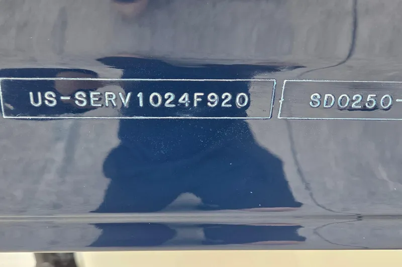 Slide: The Image of 2020 Sea Ray SDX 250 Outboard hull identification number on dark blue surface. - 6