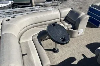 Slide: The Image of 2022 Cypress Cay Seabreeze 232 pontoon boat interior with seating and table. - 11