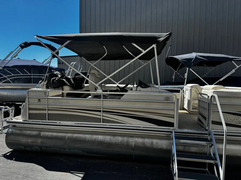 Slide: The Image of 2006 Harris Classic 240 I/O pontoon boat with canopy, side view. - 1