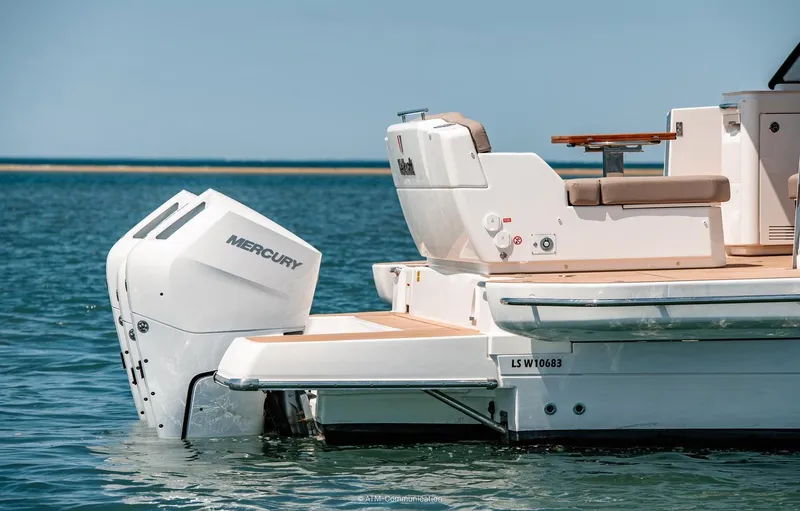 Slide: The Image of 2026 Wellcraft 44 Explorer boat with Mercury engine on calm water. - 4