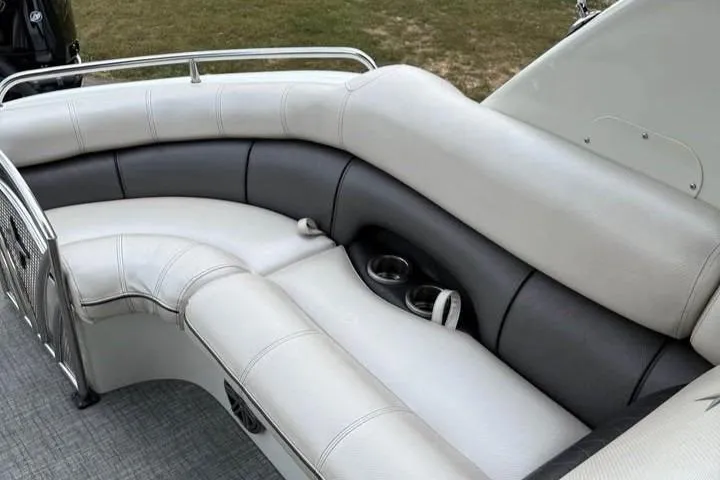 Slide: The Image of 2019 Berkshire 29 Sport RFX-DC boat interior with plush seating and cup holders. - 11