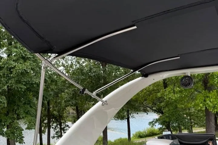 Slide: The Image of 2019 Berkshire 29 Sport RFX-DC boat canopy with scenic lake and trees in background. - 14