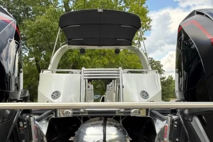 Slide: The Image of 2019 Berkshire 29 Sport RFX-DC boat with dual engines and canopy, viewed from the rear. - 18
