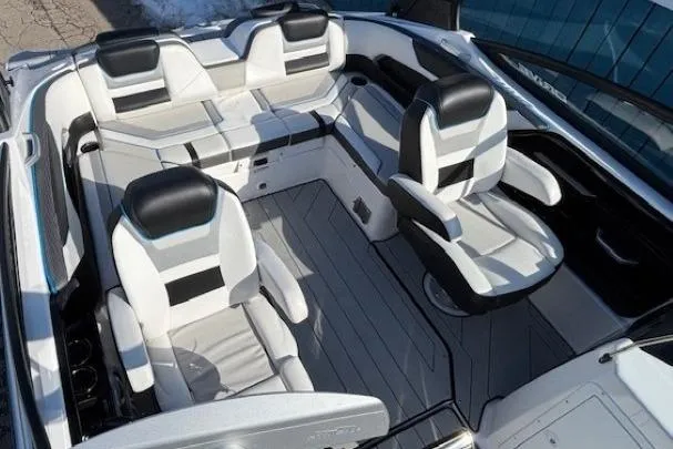 Slide: The Image of 2021 Yamaha Boats 212XD interior with sleek seating and modern design. - 12