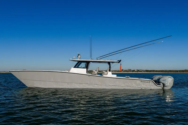 The Image of 2024 Freeman 47 boat on calm water with clear blue sky background. - 0