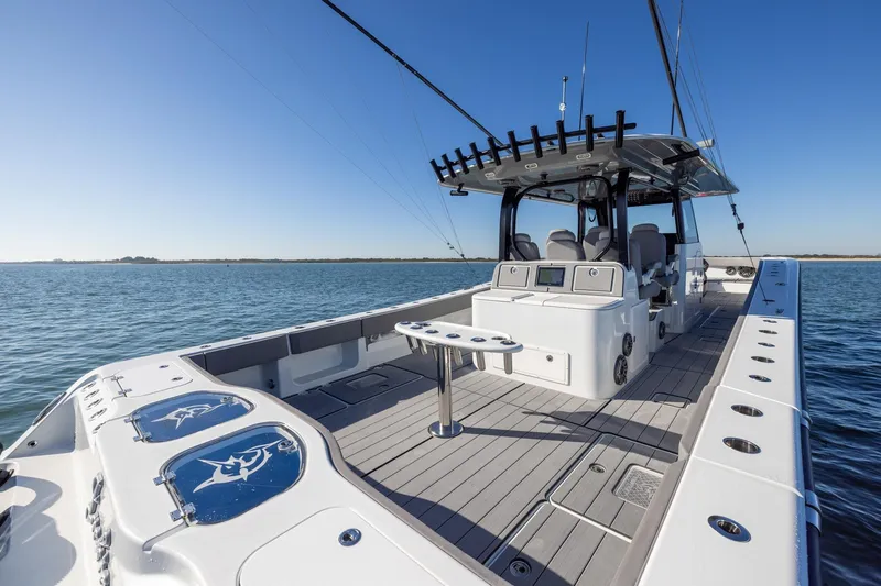 Slide: The Image of 2024 Freeman 47 boat on water, featuring spacious deck and modern design. - 15