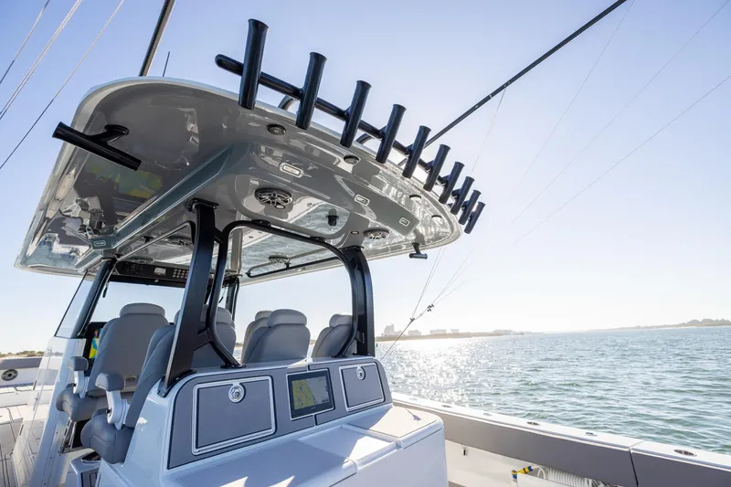 Slide: The Image of 2024 Freeman 47 boat interior with modern seating and advanced navigation system on open water. - 20