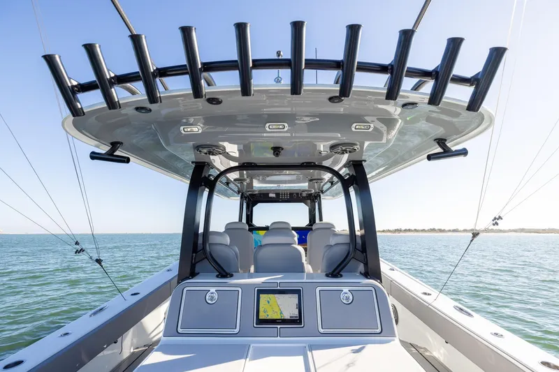 Slide: The Image of 2024 Freeman 47 boat interior with advanced navigation system on open water. - 21