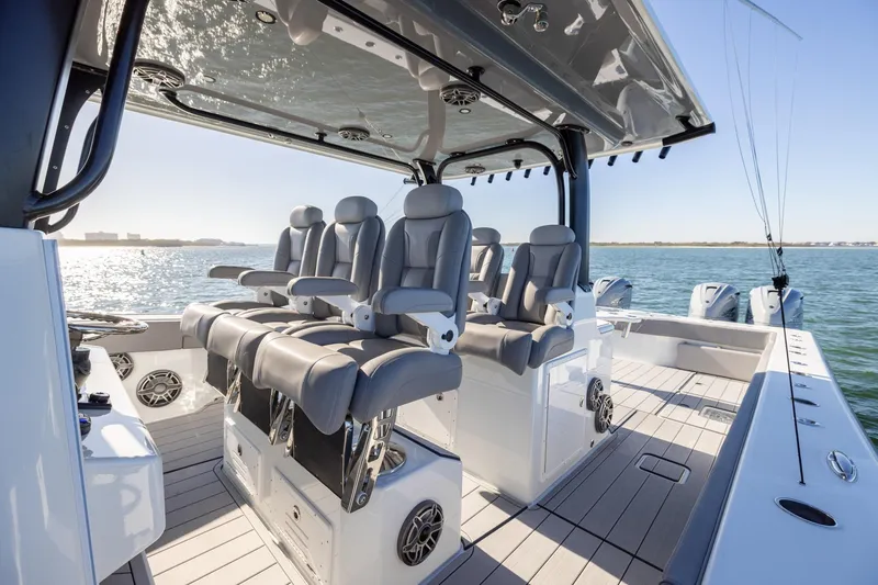 Slide: The Image of Luxurious 2024 Freeman 47 boat interior with plush seating and ocean view. - 23