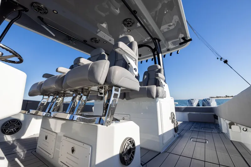 Slide: The Image of 2024 Freeman 47 boat interior with sleek seating and modern design on open water. - 25