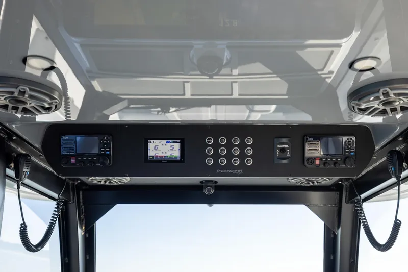 Slide: The Image of 2024 Freeman 47 boat dashboard with advanced navigation and communication systems. - 31