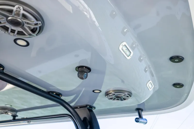 Slide: The Image of 2024 Freeman 47 boat ceiling with speakers and lights, showcasing modern marine technology. - 32
