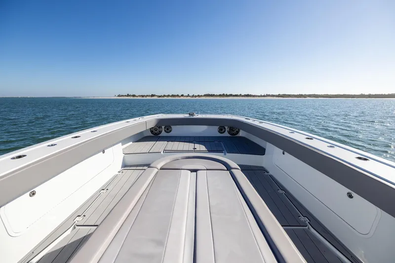 Slide: The Image of 2024 Freeman 47 boat on open water, showcasing spacious deck and sleek design. - 37