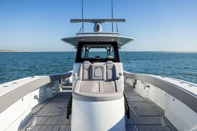 Slide: The Image of 2024 Freeman 47 boat on water, featuring spacious deck and modern design. - 39