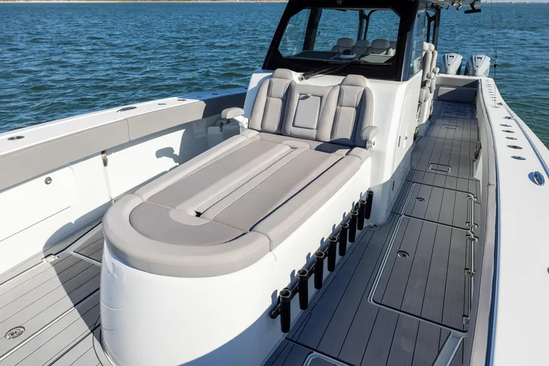 Slide: The Image of 2024 Freeman 47 boat with spacious deck and luxurious seating on the water. - 40