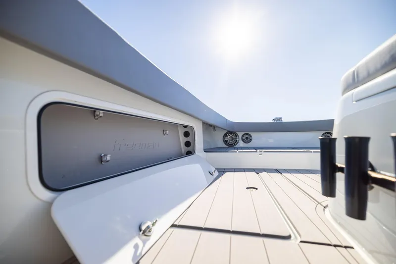 Slide: The Image of 2024 Freeman 47 boat interior with open storage compartment and sleek design. - 41