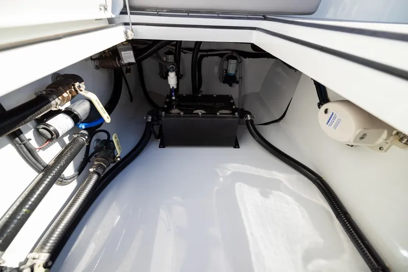Slide: The Image of 2024 Freeman 47 boat interior showing engine compartment and wiring. - 44