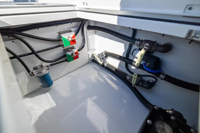 Slide: The Image of 2024 Freeman 47 boat engine compartment with hoses and valves. - 45