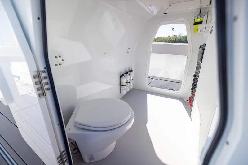 Slide: The Image of 2024 Freeman 47 boat interior with toilet and safety equipment. - 46
