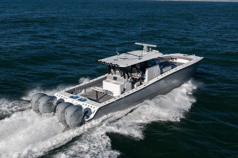 Slide: The Image of 2024 Freeman 47 boat cruising on open water, showcasing powerful engines and sleek design. - 49