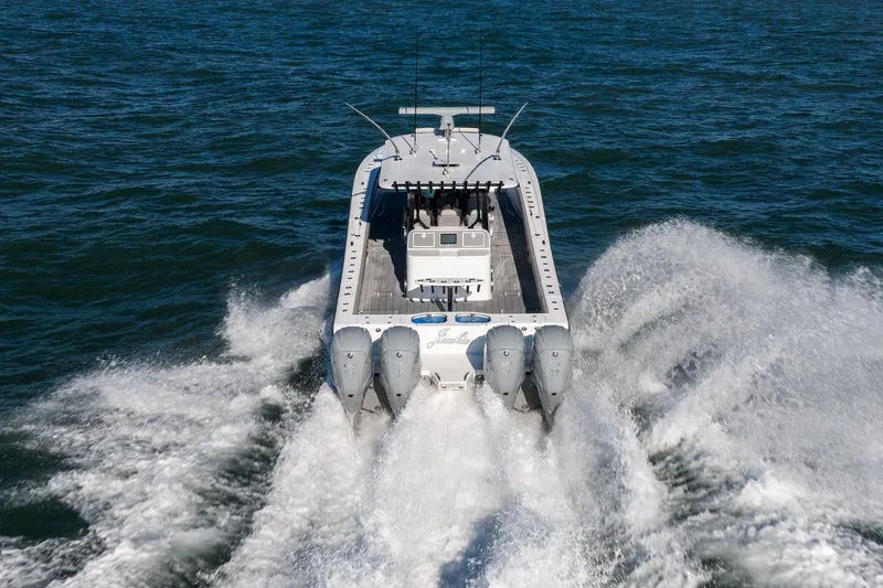 Slide: The Image of 2024 Freeman 47 boat cruising on open water with powerful engines. - 9
