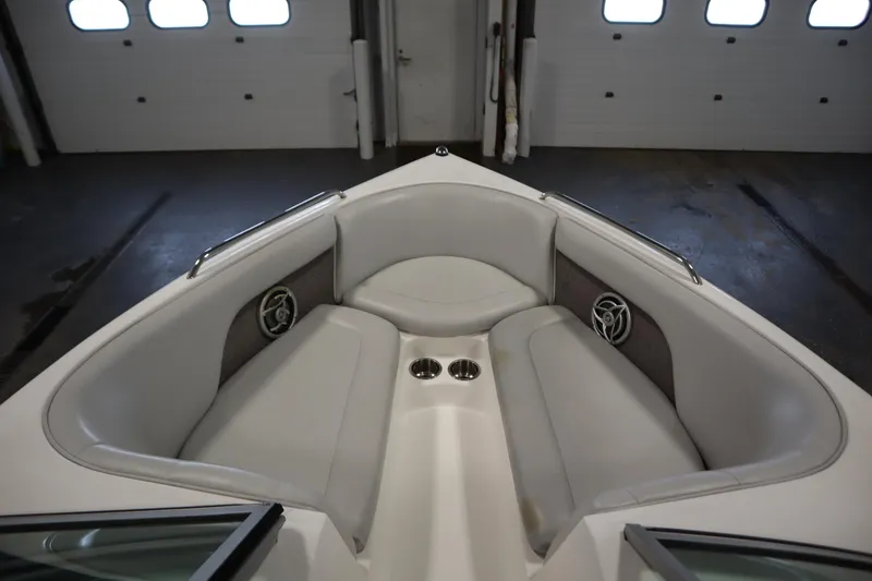 Slide: The Image of 2008 Moomba Outback V boat interior with cushioned seating and cup holders. - 11