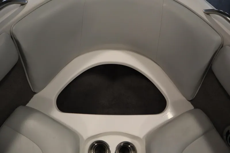 Slide: The Image of 2008 Moomba Outback V boat interior with gray seating and cup holders. - 12