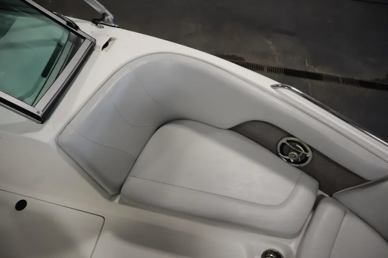 Slide: The Image of 2008 Moomba Outback V boat interior with white seating and speaker detail. - 13