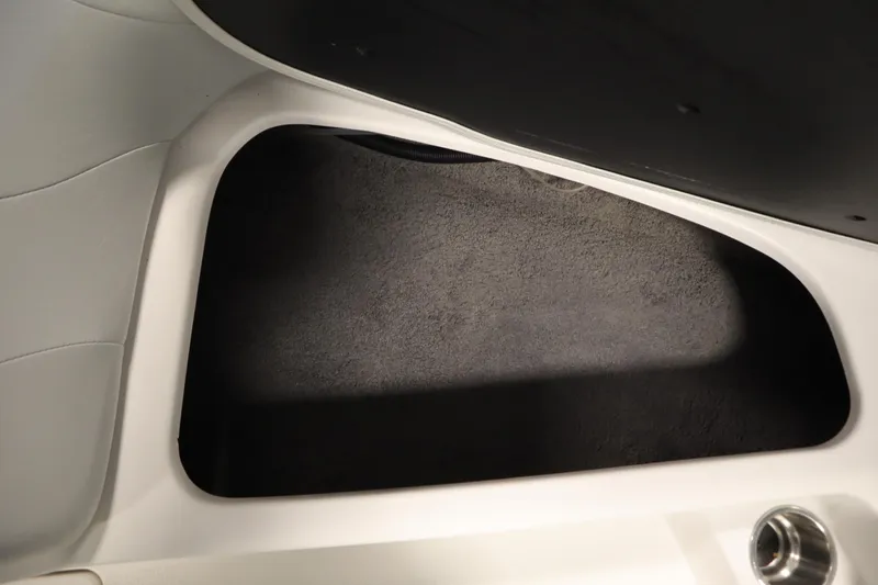 Slide: The Image of 2008 Moomba Outback V storage compartment with carpeted interior. - 14