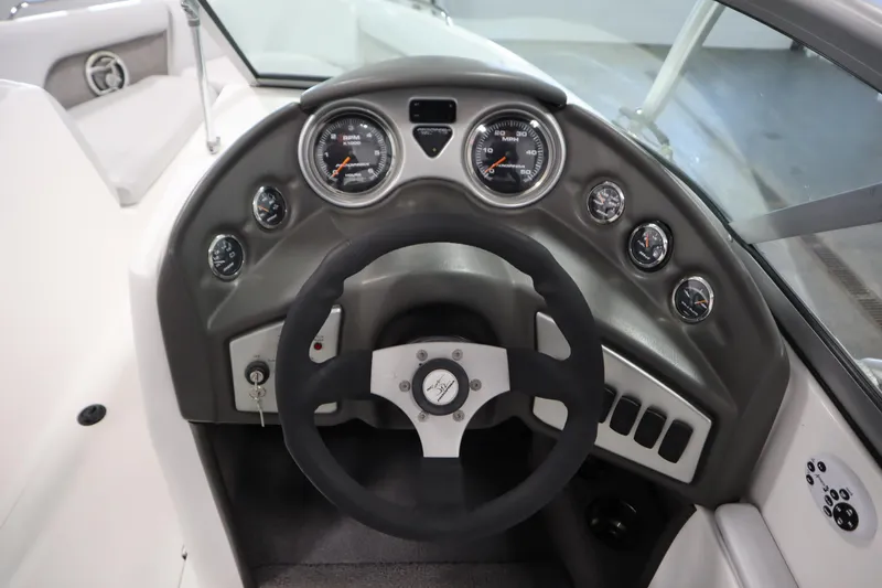 Slide: The Image of 2008 Moomba Outback V dashboard with steering wheel and gauges. - 17