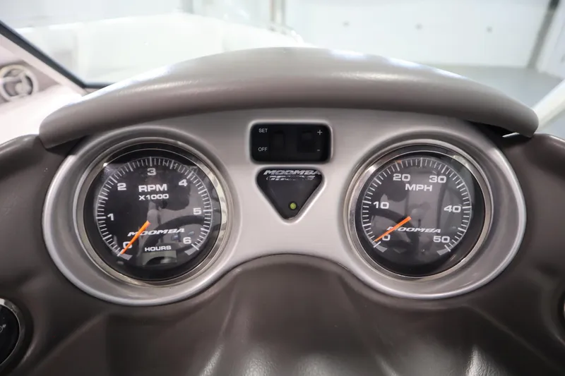 Slide: The Image of Dashboard of 2008 Moomba Outback V boat showing RPM and MPH gauges. - 19