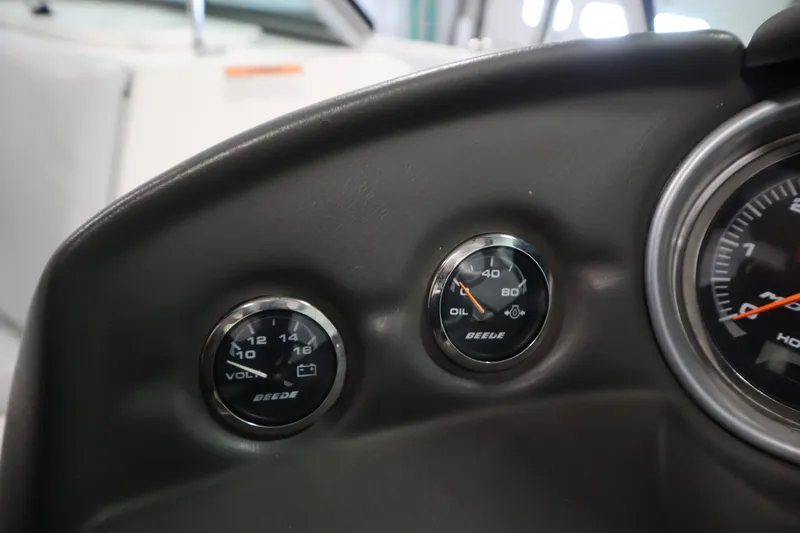 Slide: The Image of 2008 Moomba Outback V dashboard gauges, displaying voltage and oil pressure readings. - 20