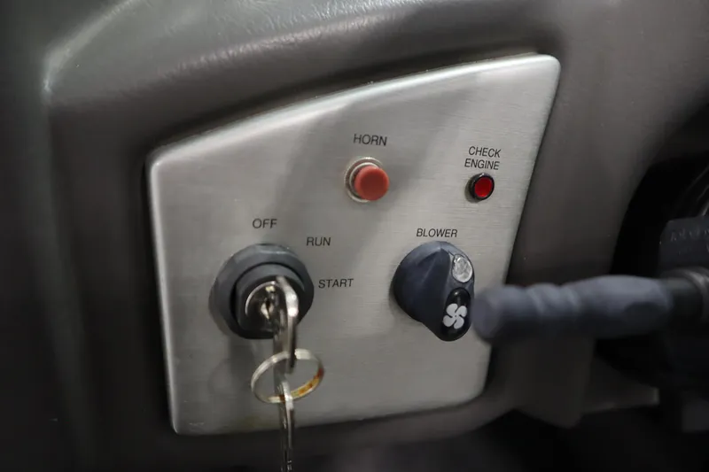 Slide: The Image of 2008 Moomba Outback V dashboard with ignition, horn, and blower controls. - 22