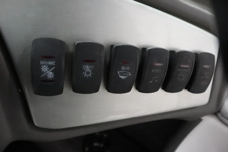 Slide: The Image of 2008 Moomba Outback V boat control panel with labeled switches. - 23