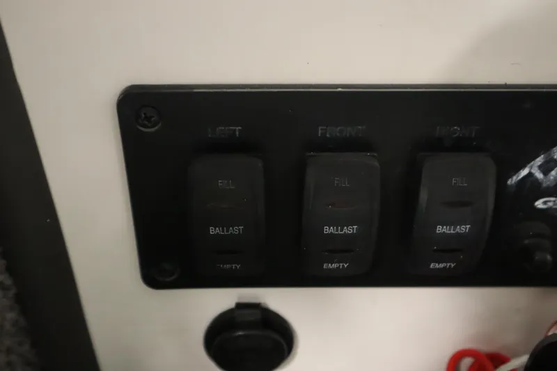 Slide: The Image of 2008 Moomba Outback V ballast control panel with fill and empty switches. - 25