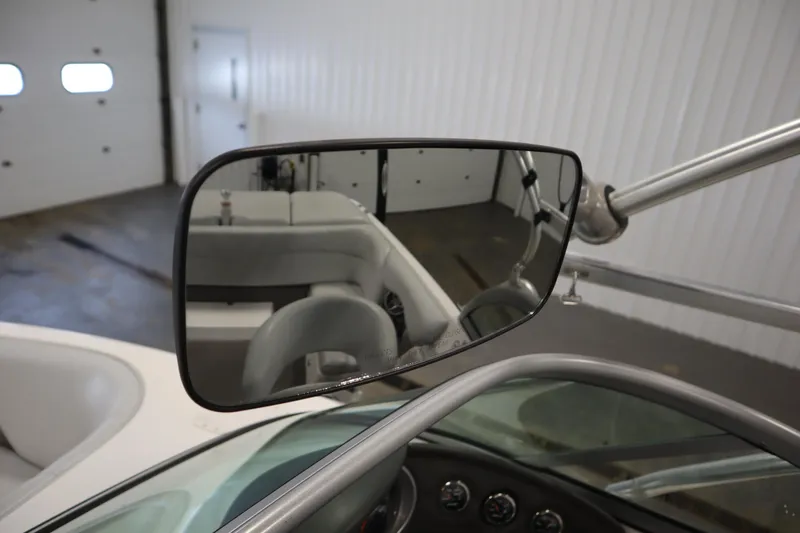 Slide: The Image of 2008 Moomba Outback V boat interior with rearview mirror and dashboard. - 28