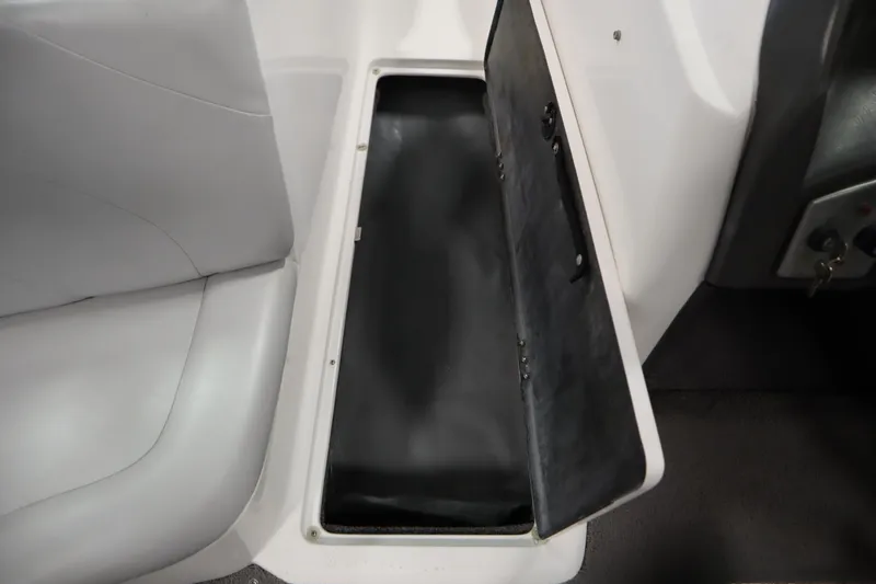 Slide: The Image of 2008 Moomba Outback V boat storage compartment with open lid, showcasing interior space. - 32