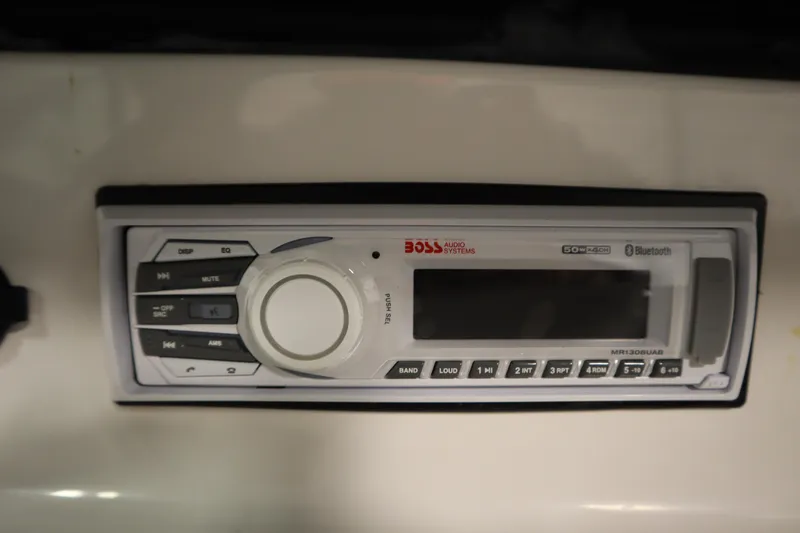 Slide: The Image of Boss Audio Systems stereo in 2008 Moomba Outback V boat dashboard. - 34