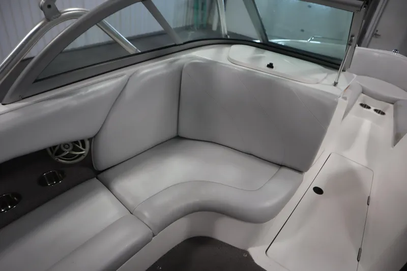 Slide: The Image of 2008 Moomba Outback V interior with gray seating and cup holders. - 36